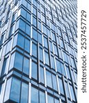 Architecture photography of modern glass and metal skyscraper.  "Ušće Office Tower 2" Height of 22 floors and 103.9 m (341 ft) and a total floor area of 28.000 m2 (301.39 sq ft).