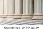The architecture of some neoclassical columns in a row.