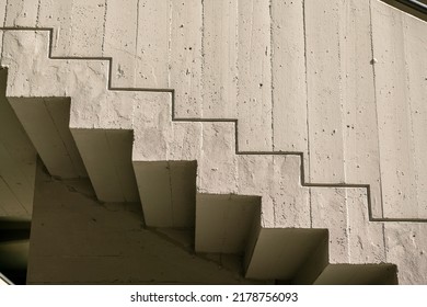 architecture: staircase with particular external fire ramp to a modern building, in reinforced concrete and granite floor, consistent with the building.