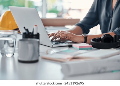 Architecture, typing and hands of woman on laptop for research, review or online report in building development. Computer, networking and architect writing email, feedback and planning with blueprint - Powered by Shutterstock