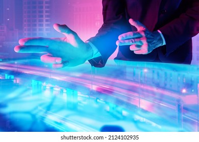An architecture using virtual technologies for creating a modern city layout. Digital holograms, charts. Contemporary digital technologies. 