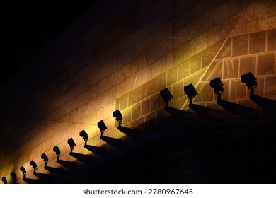 Architecture wall light shadow spotlight night abstract pattern modern design urban wall architecture with dramatic spotlight shadow pattern at night creating abstract modern design mood