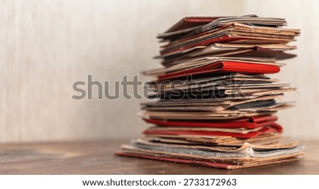 The archive of documents is in a stack on the table. A file cabinet on papers.Information search.