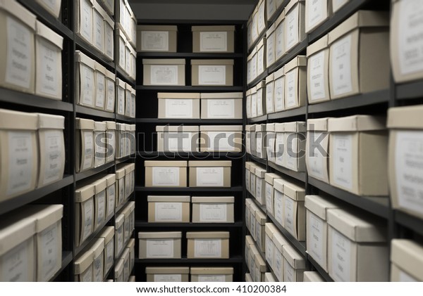 Archive evidence police depository\
cardboard box black shelves with white office boxes card\
file