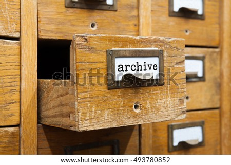 Archive system concept photo. Opened box archive storage, filing cabinet interior. wooden boxes with index cards. library service information management. shallow depth of field