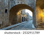 An archway across the historic Street of the Knights, built by the Knights Hospitaller in medieval times, Rhodes, Greece.