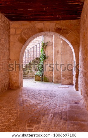Archway to the internal backyard with no people in Sos del Rey Catolico downtown, Aragon, Spain