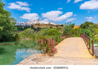 Arcos De La Frontera Reflected On River Guadalete In Spain