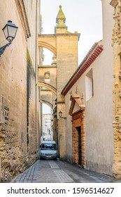 Arcos De La Frontera, Spain - April 12, 2019:  Tight Squeeze Through The Old City Gates.  
