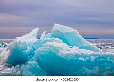 Arctic Blue Glacier Ice Hummock In Cloudy Weather.