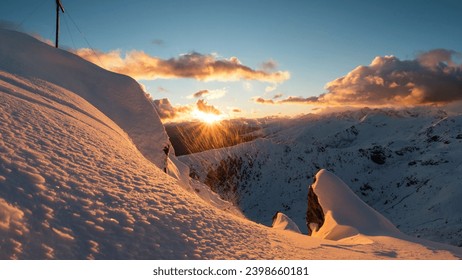 Arctic Dawn: Sunrise Casting a Gentle Glow Over Snow-Adorned Mountains - Powered by Shutterstock