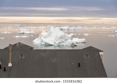 Arctic Icebergs Greenland In The Arctic Sea. You Can Easily See That Iceberg Is Over The Water Surface  And Below The Water Surface. Sometimes Unbelievable That 90% Of An Iceberg Is Under Water 