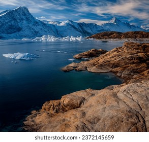 Arctic summer. Icebergs floating in Northwest Fjord in Scoresbysund, eastern Greenland. - Powered by Shutterstock