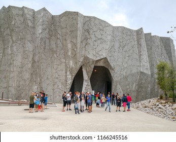 Ardeche, France - August 9, 2018: Visitors visiting Caverne du Pont-d'Arc, a facsimile of Chauvet Cave, a cave that contains some of the best-preserved figurative cave paintings in the world. 