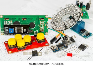 Arduino Components And Electronic Components Over Electronic Diagram, Printed Wiring, Transistors, Integrated Circuits, Capacitors, Resistors, LED, Semiconductors, Infrared Leds