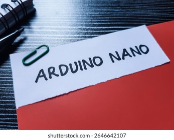 Arduino nano writting on table background. 