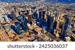 An area of beautiful skyscrapers in the uptown of Dallas, Texas, USA. Vast scenery of the city from top on sunny day.