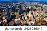 An area of beautiful skyscrapers in the uptown of Dallas, Texas, USA. Vast scenery of the city from top on sunny day.