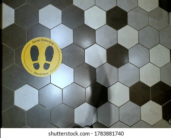 Area is covered with hexagonal tiles in various colors and affixed to the standing sticker