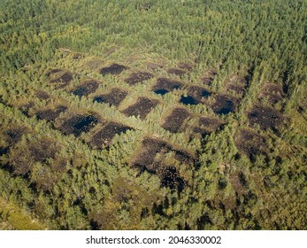 Areal View Of Bog Where Peat Was Once Extracted. Panes That Look Like Checkers Or A Chess Board.