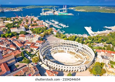 Arena Pula. Ancient ruins of Roman amphitheatre and Pula waterfront aerial view, Istria region of Croatia