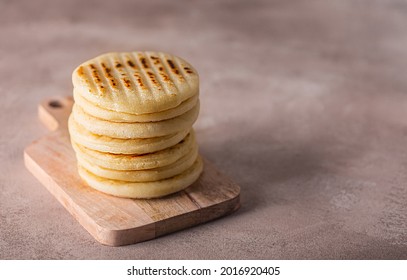 Arepa Made From Ground Corn Dough, Cornmeal, Traditional In The Cuisine Of Colombia And Venezuela With Copy Space