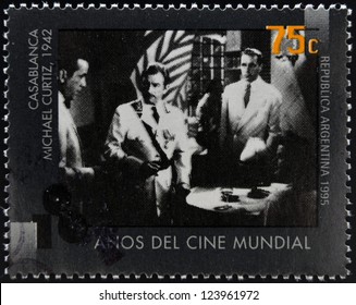 ARGENTINA - CIRCA 1995: A stamp printed in Argentina dedicated to 100 years of world cinema shows Casablanca scene of Michael Curtiz, circa 1995
