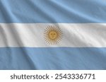 Argentina flag depicted on folded wavy fabric of old cloth close up