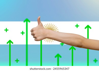 Argentina flag with green up arrows, upward rising arrow on data, increasing values and improving economy, country statistics concept, finger thumbs up front of Argentina flag - Powered by Shutterstock