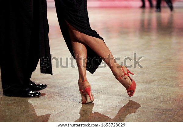 Argentina tango. Woman in red shoes dancing\
argentinian tango.