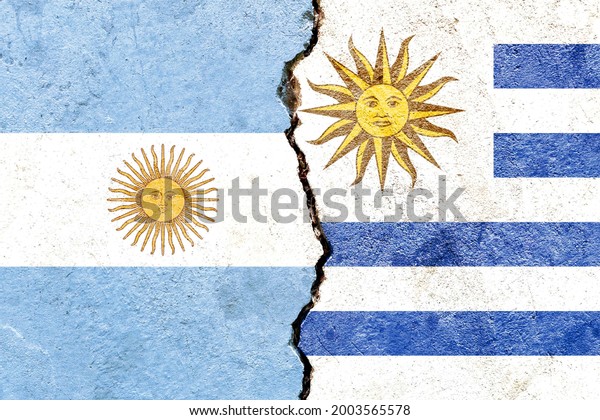 Argentina vs Uruguay national flags grunge\
pattern isolated on broken cracked wall background, abstract\
Argentine Uruguay politics relationship friendship divided\
conflicts concept texture\
wallpaper