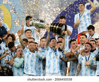 Argentina's Lionel Messi holds the trophy as he celebrates with teammates after beating 1-0 Brazil in the Copa America final soccer match at the Maracana stadium in Rio de Janeiro, Brazil
10 Jul 2021