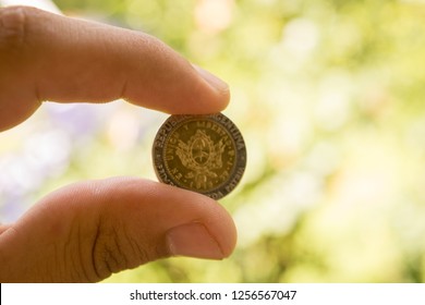 Argentine Peso Coin In Hand.