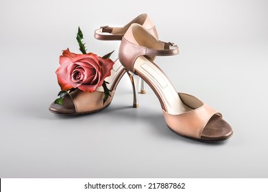 Argentine Tango Shoes With A Rose On Neutral Background 