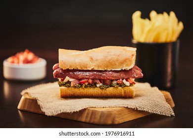 Argentinian Choripan With Chimichurri And Creole Sauce.