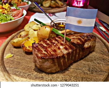 argentinian rump steak with side dishes and argentinian flag 