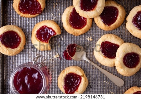 Argentinian traditional cookies called Pepas filled with jam placed on old iron tray