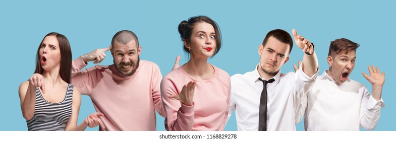 Argue, arguing concept. Beautiful male and female half-length portrait isolated on blue studio backgroud. Young emotional surprised men and woman looking at camera. Human emotions, facial expression - Shutterstock ID 1168829278