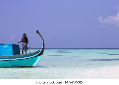 Ari Atoll, Maldives - 25 December 2018: A maldivian sailor is fishing on his boat