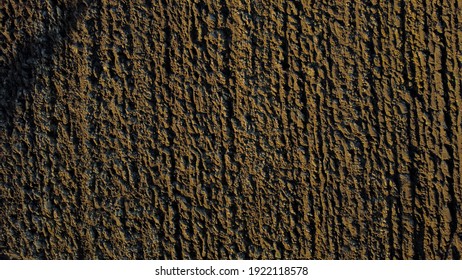 Arial Drone View Of Freshly Plowed Field Ready For Seeding And Planting In Spring.  Farmland. Empty Plowed Farm Land Prepared For The New Crop. Agriculture. Brown Black Soil Near Village.