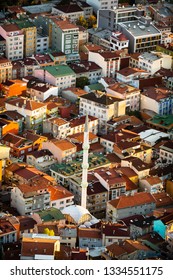 Arial Shot Of A Densely Populated District In Istanbul With A White Mosque And Its Tall Minaret.