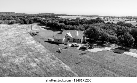 Arial Shot Of House Near Hay Field