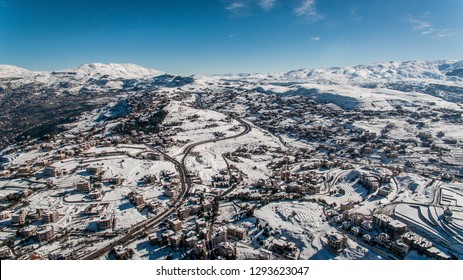 Arial Shot Of Snowy Mountains And Landscape In Lebanon