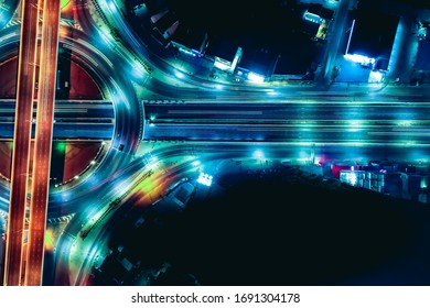 Arial Top View Of Modern Transportation With Expressway, Road And Roundabout,  Road Traffic, Multilevel Junction Highway-Top View. Important Infrastructure And Transport In Big City, Bangkok Thailand.