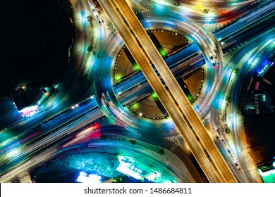 Arial top view of Smart, Modern transportation with Expressway, Road and Roundabout,  Road traffic, multilevel junction highway-Top view. Important infrastructure architecture,  transport in big city.