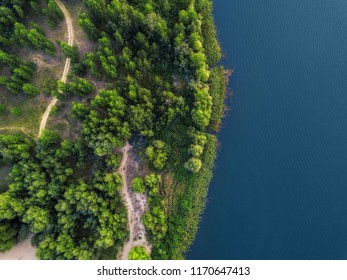 Arial Veiw Of Sandy Beach, Green Trees And Blue Sea (ocean, Lake, River). Drone Shot