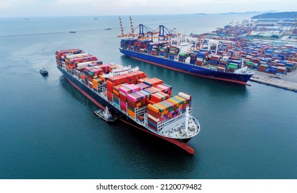 Arial view by drone camera transportation logistics and container dock cargo yard with working crane bridge in shipyard with transport logistic import export with blue sky background. - Shutterstock ID 2120079482