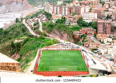 Arial View Of The City And  Football Field. People Enjoying Sports Outdoors. Cardona. Spain. 