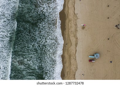 Arial View Of A Coastline Beach With People 