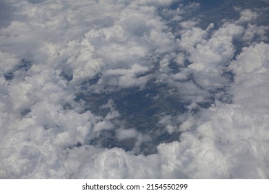 Arial view with fluffy clouds .